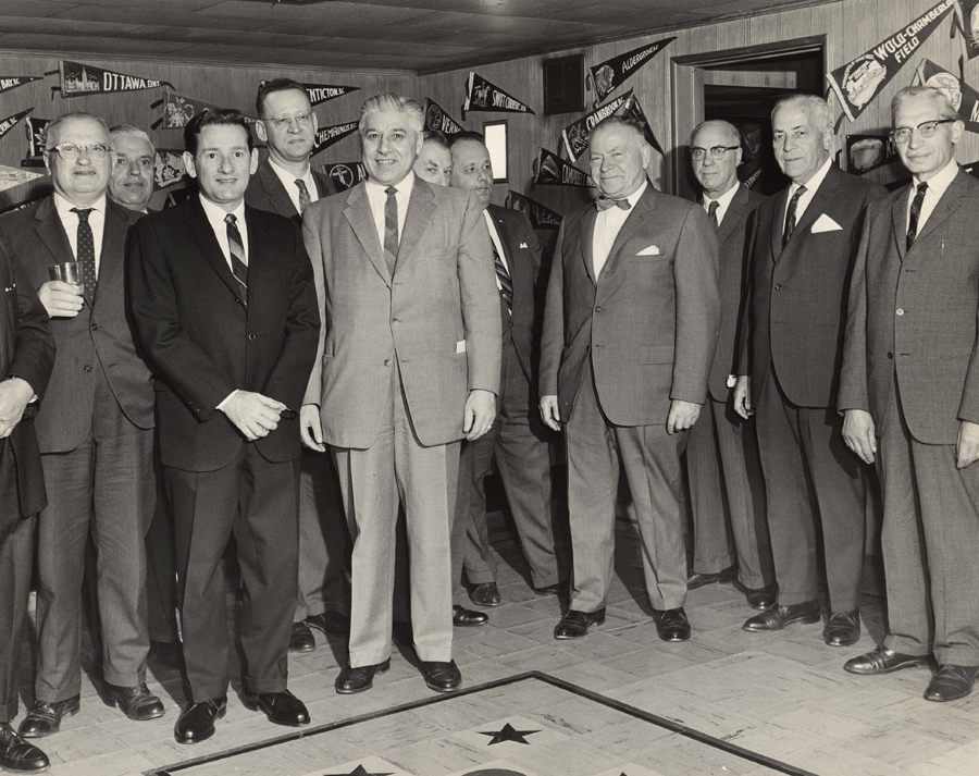 Group of men in formal dress, including Morris Wosk top row, left, at a State of Israel Bonds event, Vancouver, B.C., 1976.